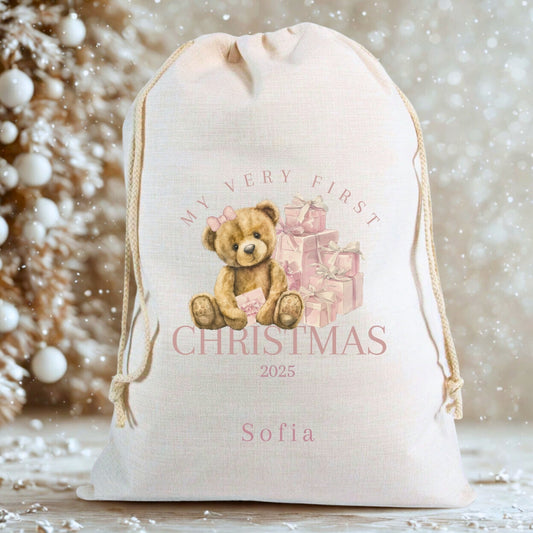 Personalised First Christmas Santa Sack featuring a teddy bear and gifts, ideal keepsake for baby's first Christmas.