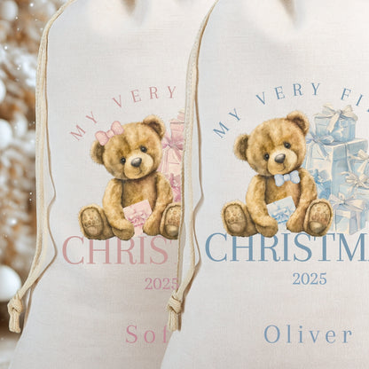First Christmas Santa Sack featuring a teddy bear design personalised with names and year 2025 for babies.