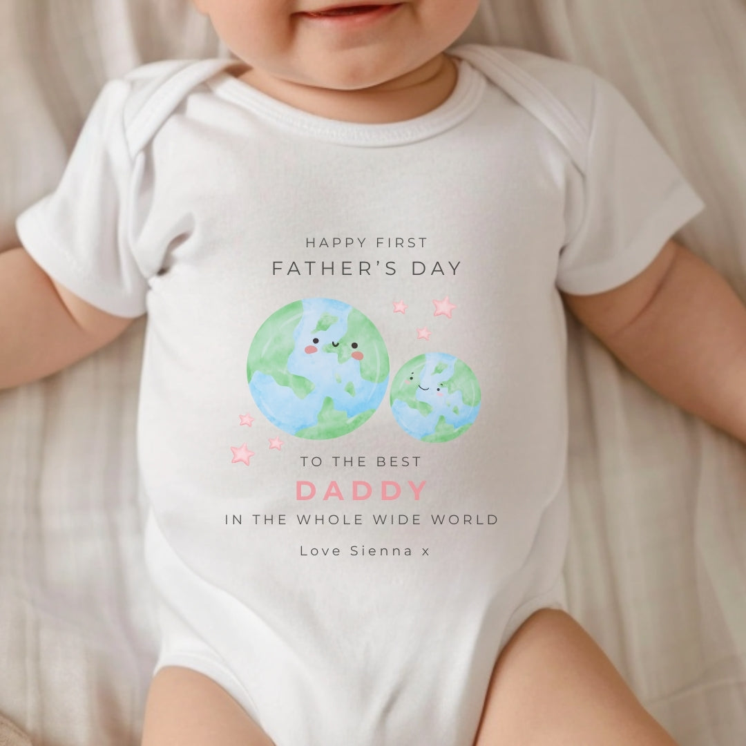 personalised vest celebrating first father's day, featuring a heartfelt message and cute planet design.