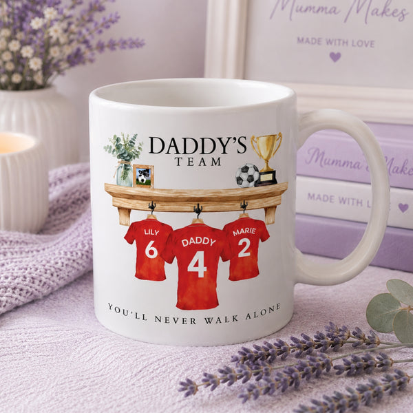 Personalised Football Lover Gift Mug featuring shirts, trophy, and text for loving football fans.